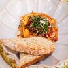 Яичница Менемен с томатным соусом и пряными травами в Коза Тапас по цене 530