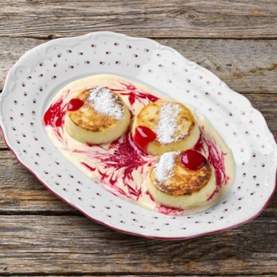 Сырники с заварным кремом и малиновым вареньем в Литвины по цене 19 р.