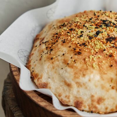 Лепешка с кунжутом и фисташками в Folk по цене 350 ₽