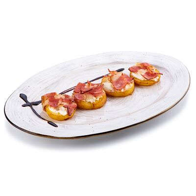 Картофель печеный в беконе с рикоттой в Trattoria по цене 456 ₽