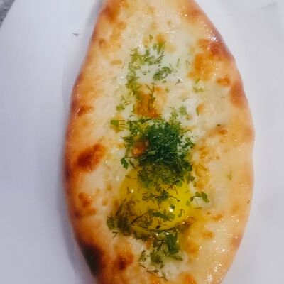 Хачапури по-аджарски в Oasis по цене 420 ₽