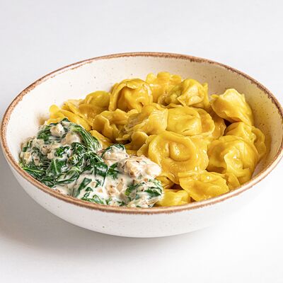 Пельмени с курицей и индейкой со сливочно-шпинатным соусом в Kitchen по цене 590