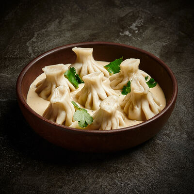 Мини-хинкали с говядиной в сливочно-горчичном соусе в Гранат по цене 490 ₽