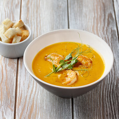Тыквенный суп с креветками на кокосовом молоке в Кофейня на Остоженке по цене 880 ₽