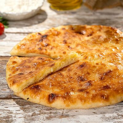 Картофель с сыром 850 г в Пиросетия Осетинские пироги по цене 850 ₽