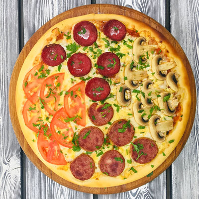 Пицца Четыре сезона в Гиро пицца халяль по цене 440 ₽