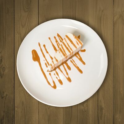 Чизкейк классический с карамельным топпингом в Мон Батонъ по цене 286 ₽