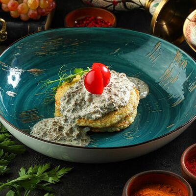 Картофельные драники с грибным соусом в Добрый Грузин по цене 400 ₽