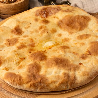 Осетинский пирог с сыром и картофелем в Осетинские пироги Баркад по цене 999 ₽