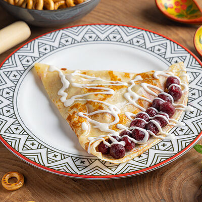 Блин с вишней и ванильным кремом в Блин Блинский по цене 400 ₽