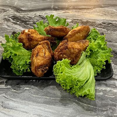 Крылышки в специях в Суши-бар Макото по цене 390 ₽