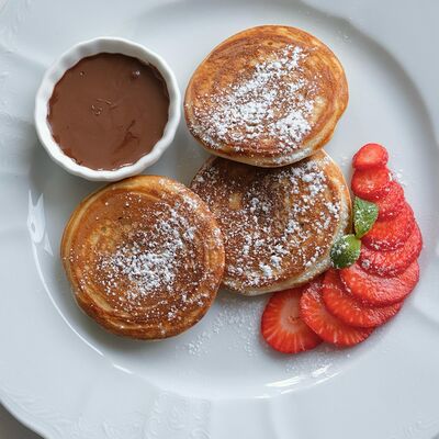 Оладьи с нутеллой в Мандарин по цене 585 ₽