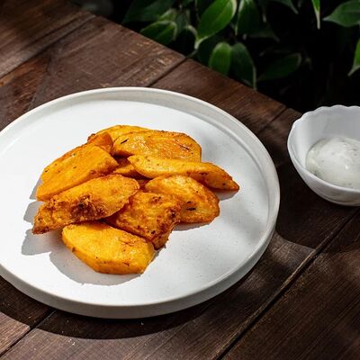 Картофель по-деревенски с фирменным соусом в Грин по цене 220 ₽