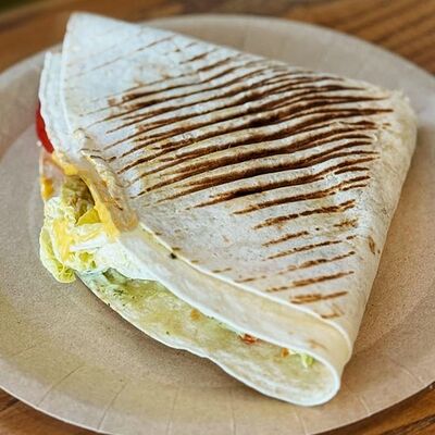 Фирменная кесадилья в Ками cafe club по цене 647 ₽