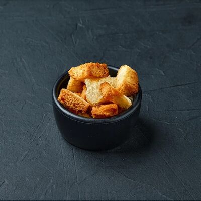 Гренки к супу в Mesto Sushi & Grill по цене 30 ₽