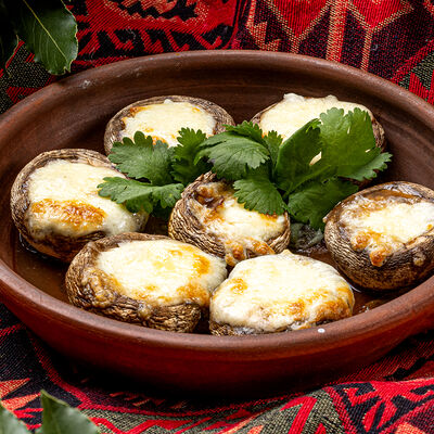 Шляпки шампиньонов с сыром в Хмели & Сунели по цене 540 ₽