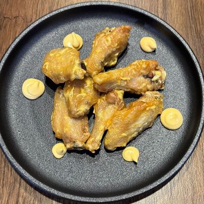 Сырные куриные крыльяв Ragnar bar по цене 595 ₽