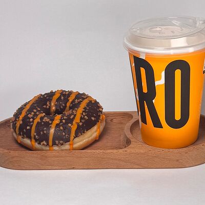 Кофе и пончик Донатс с начинкой Апельсин и глазурью из темного шоколада в Do.bro coffee по цене 670 ₽