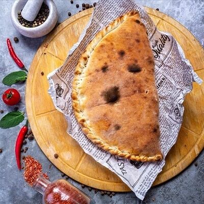 Пицца кальцоне 26см 500 г в Donna Maria PREMIUM по цене 920 ₽