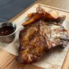 Свиные рёбрышки с соусом BBQ и картофельными дольками в Про Тесто по цене 710