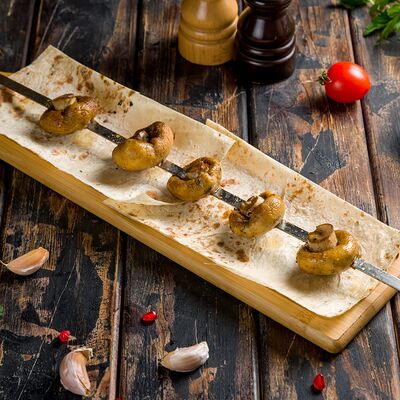 Шампиньоны на мангале в ШаурМангал по цене 235 ₽