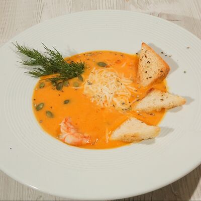 Тыквенный суп-пюре с креветкамив Троя по цене 680 ₽
