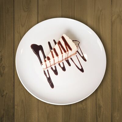 Чизкейк классический с шоколадным топпингом в Мон Батонъ по цене 286 ₽