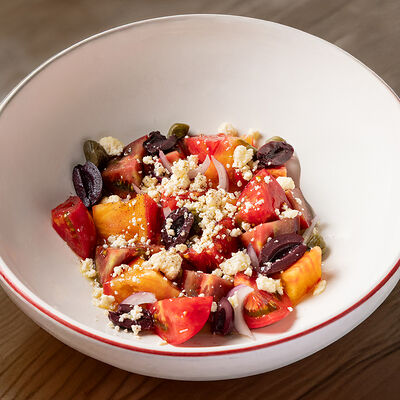 Салат из томатов, брынзы и каперсов в Dacha restaurant по цене 840 ₽