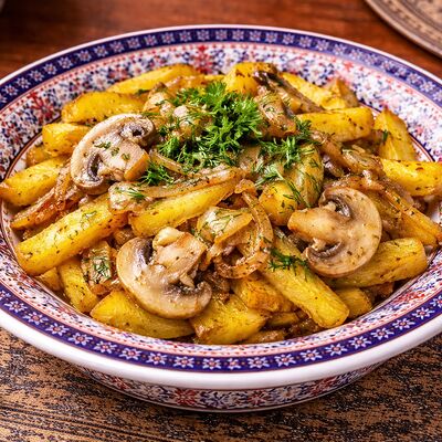 Жаренка из картофеля с грибами в Тминъ по цене 280 ₽