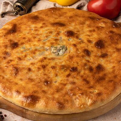 Осетинский пирог с сыром и свекольными листьями в Осетинские пироги Баркад по цене 999 ₽