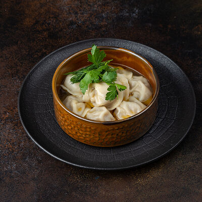 Пельмени свино-говяжьи в бульоне в Город детей по цене 300 ₽