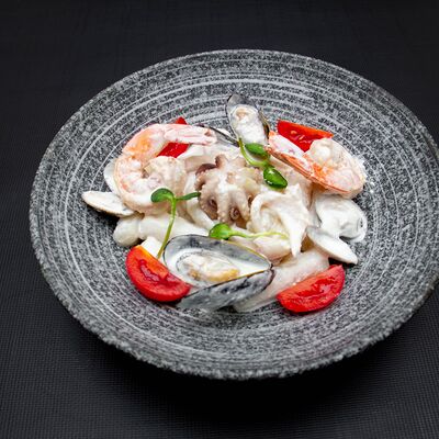 Токпоки в сливочном соусе с морепродуктами в Сеул по цене 600 ₽