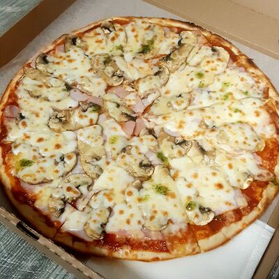 Ветчина и грибы в Вкусно Пицца по цене 590 ₽