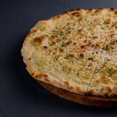 Фокачча с травами и чесночным маслом в Траттория для друзей по цене 220 ₽