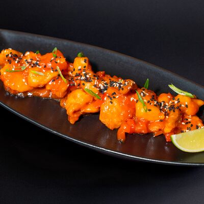 Курица в кисло-сладком соусе в Пудл Нудл по цене 510 ₽