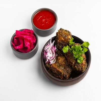 Томленые говяжьи ребра в аджике в DiDi по цене 1650 ₽