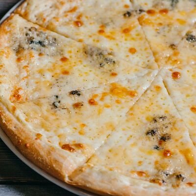 Четыре сыра на белом соусе в Досытаевский по цене 550 ₽