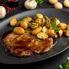 Отбивная с картофелем и грибами в Сытый Лось по цене 990