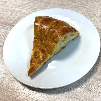 Кусок лепешки узбекской в Уютное кафе по цене 20 ₽