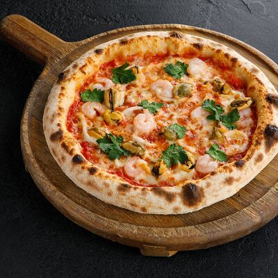 Пицца с морепродуктами в Мама Пицца & Роллы по цене 790 ₽