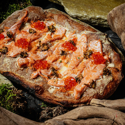 Лепешка с красной рыбой, юколой и лимонным соусом в MANUL по цене 1300 ₽