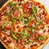 Пицца с прошутто и вялеными томатами в Eat eat pizza по цене 680