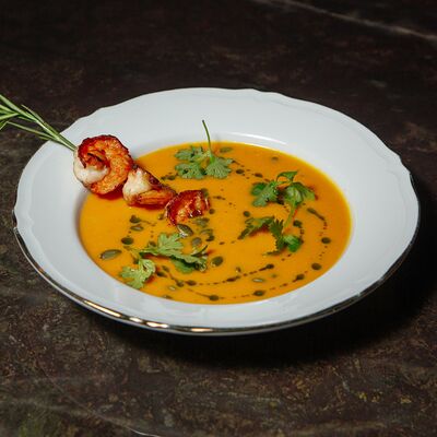 Тыквенный крем-суп с креветками в Sigma по цене 1200 ₽