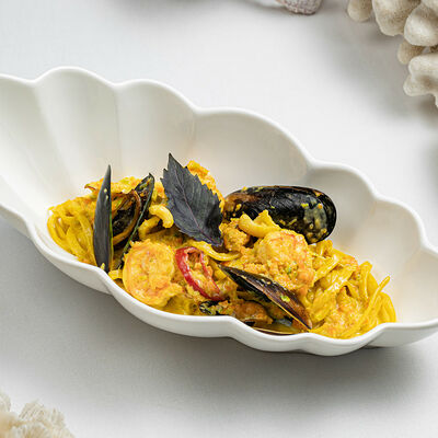 Феттуччине с морепродуктами с соусом специаль в More & More по цене 1190 ₽