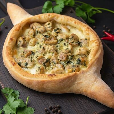 Хачапури по-Аджарски со сливочной курочкой в Аджапури по цене 590 ₽