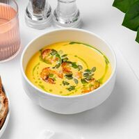 Тыквенный суп с креветками, семечками и гренками из бриоши в Eclair