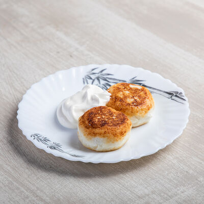 Сырники со сметаной в Русский чай по цене 150 ₽