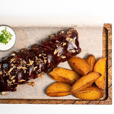 Свиные рёбрышки в Harats pub по цене 990 ₽