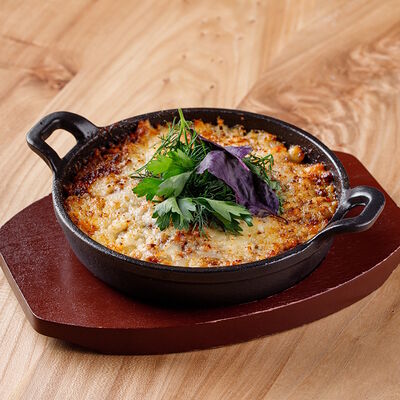 Мясное рагу с запеченным картофелем под сыром сулугуни в ПуриПури по цене 720 ₽