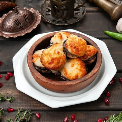 Шапочки шампиньонов с сыром сулугуни на кеци в Генацвале на Арбате - грузинский ресторан по цене 790 ₽